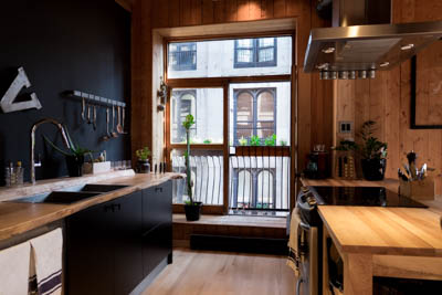 Planters with herbs on the kitchen window.