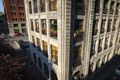 Corner view of the building with the full apartment with the planters in place.