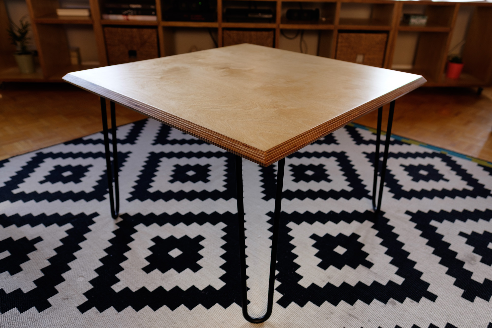 Table side view where you see the rabbet and hairpin legs.
