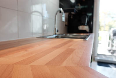 The sink sits on top of the countertop.