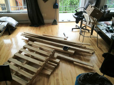 A pile of wooden palettes and reclaimed wood.