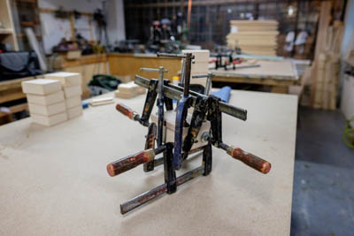 A box with 6 clamps while the glue cures.