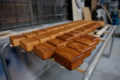 Angle view of the blocks getting their oil finish.