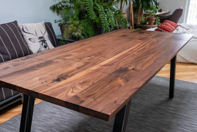 The wood grain runs the full length of the table.
