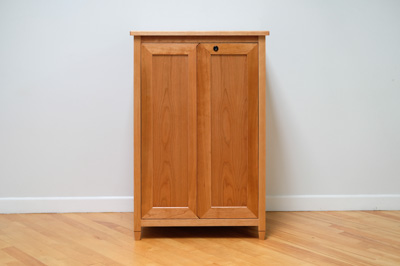 Front view of the piece with the doors closed.